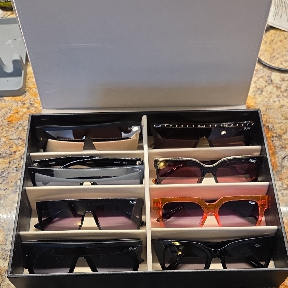 Quay Sunglasses Collection In Display Case